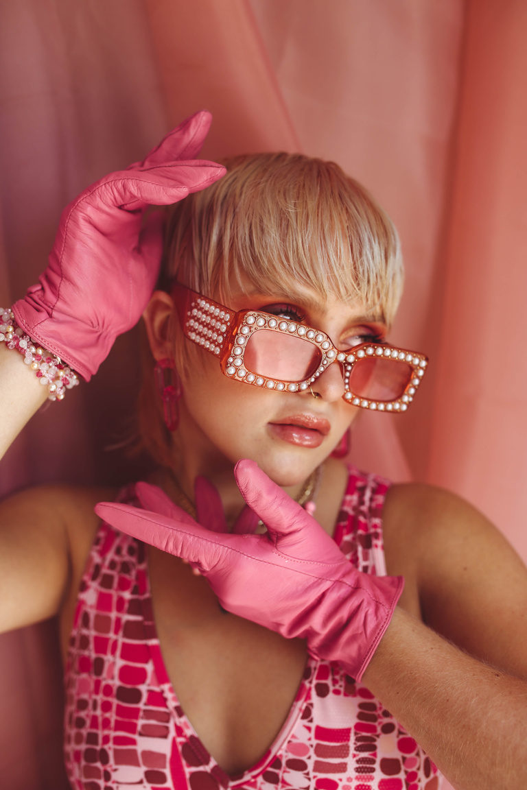 Woman with Pink Gloves and Sunglasses