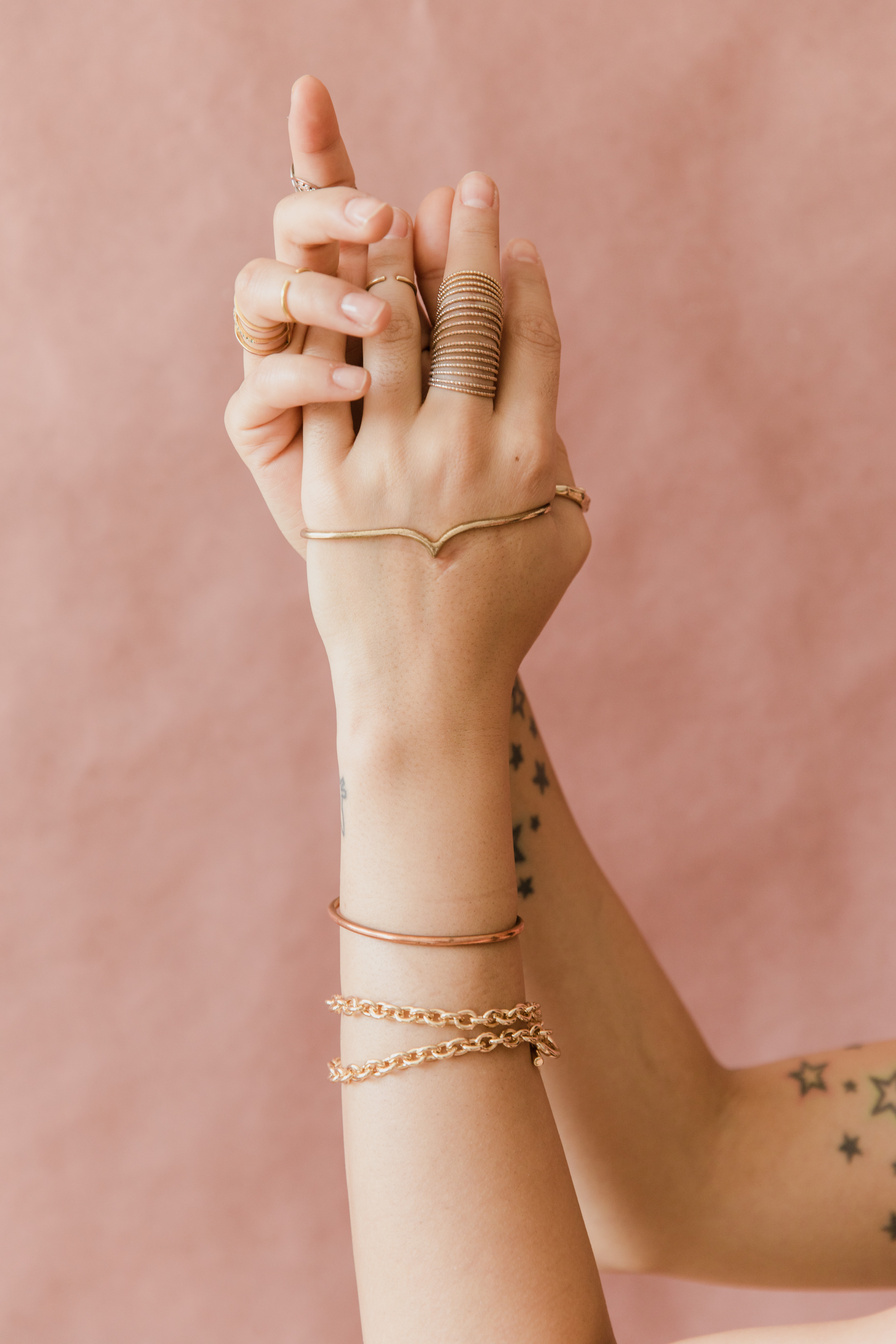 Person Wearing Silver Bracelet and Bracelet